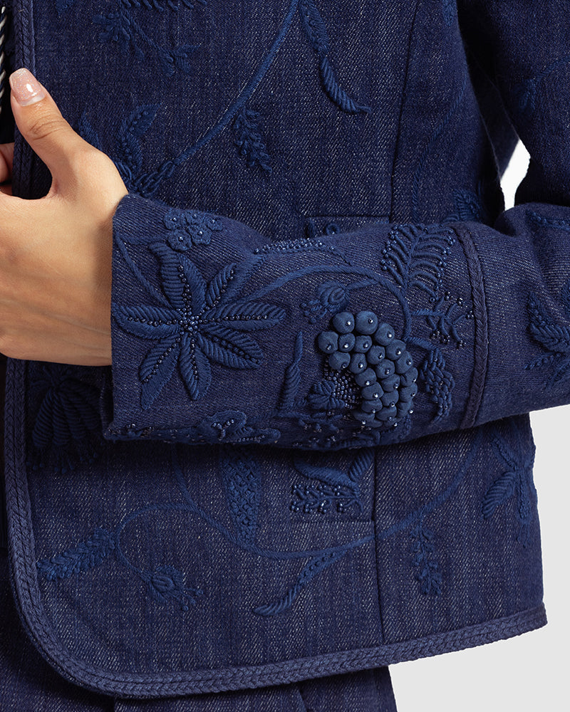 Embellished Handwoven Denim Jacket
Product DescriptionThis fitted, cropped denim jacket is adorned with floral hand embroidery and beading inspired by centuries-old folk miniature paintings. The jackJacketsEmbellished Handwoven Denim Jacket