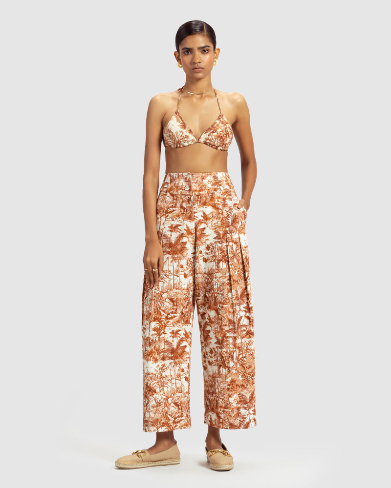 Brown Tropical Print Cotton Twill PantProduct DescriptionMade from cotton twill, these high-waisted pleated pants feature our statement tropical print that reimagines Indian flora and fauna motifs with cPantsBrown Tropical Print Cotton Twill Pant
