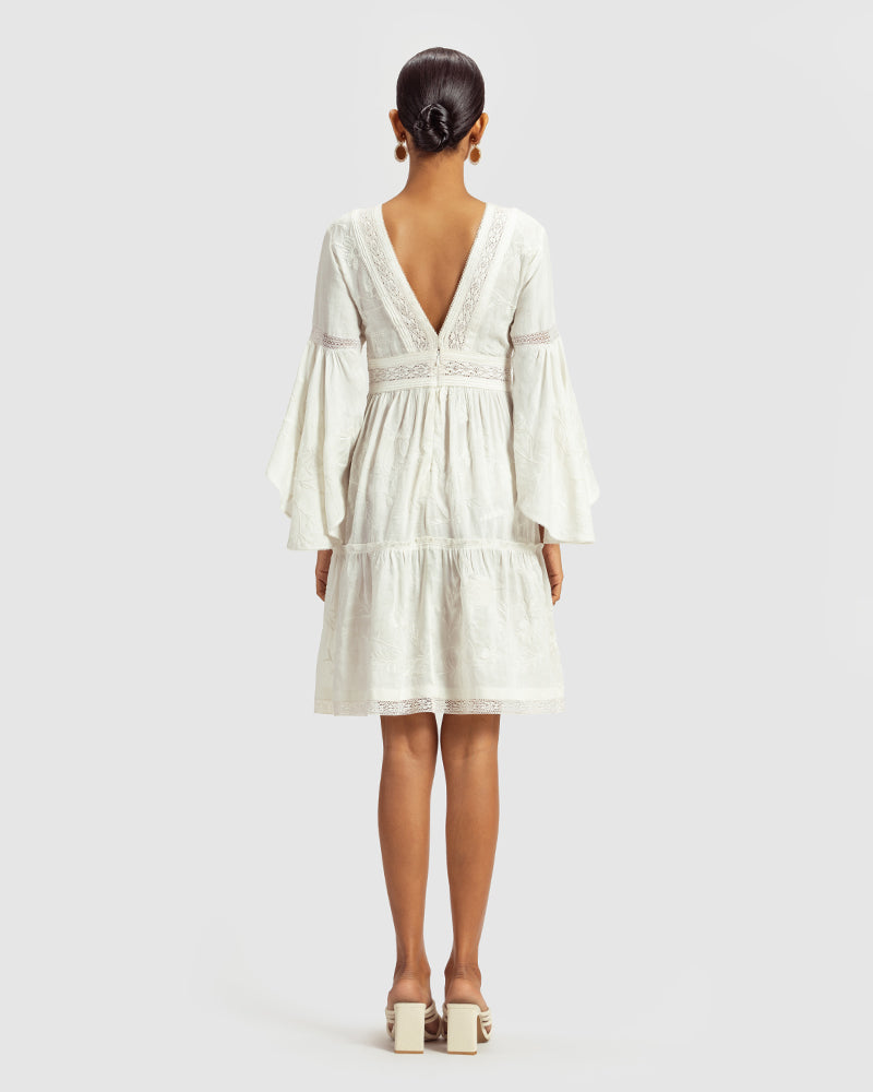 White Lace Trimmed Embroidered Linen Blend DressProduct DescriptionThis breezy linen blend dress features a mix of lace inserts and white-on-white embroidery inspired by Indian floral and fauna motifs. Also includDressesWhite Lace Trimmed Embroidered Linen Blend Dress
