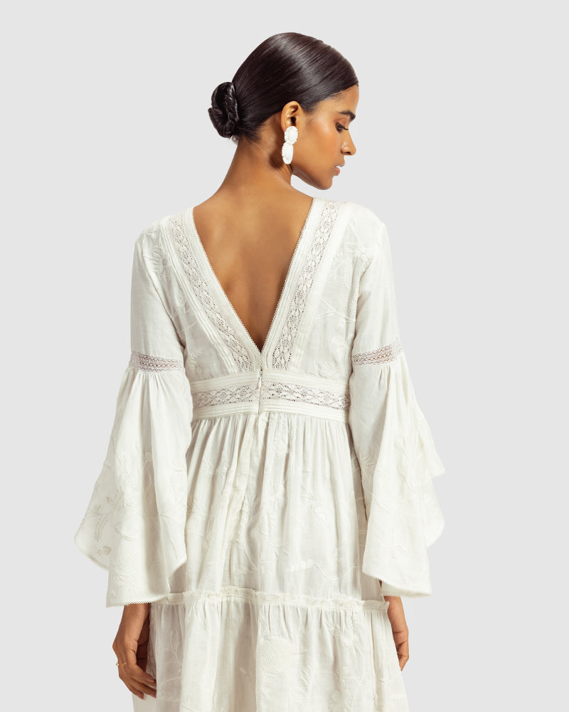 White Lace Trimmed Embroidered Linen Blend DressProduct DescriptionThis breezy linen blend dress features a mix of lace inserts and white-on-white embroidery inspired by Indian floral and fauna motifs. Also includDressesWhite Lace Trimmed Embroidered Linen Blend Dress