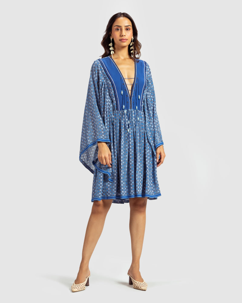 Blue Geo Print Gathered Silk DressProduct DescriptionWith print patchwork inspired by folk geometric patterns, this gathered dress is how we’ve reimagined Talitha’s signature bohemian language. Made DressesBlue Geo Print Gathered Silk Dress