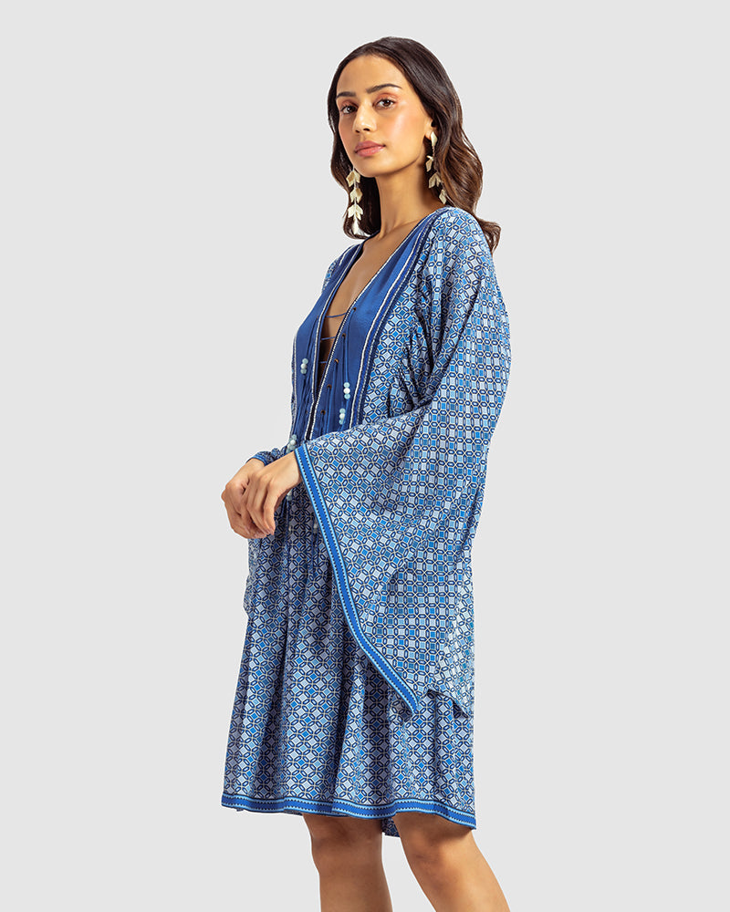 Blue Geo Print Gathered Silk DressProduct DescriptionWith print patchwork inspired by folk geometric patterns, this gathered dress is how we’ve reimagined Talitha’s signature bohemian language. Made DressesBlue Geo Print Gathered Silk Dress