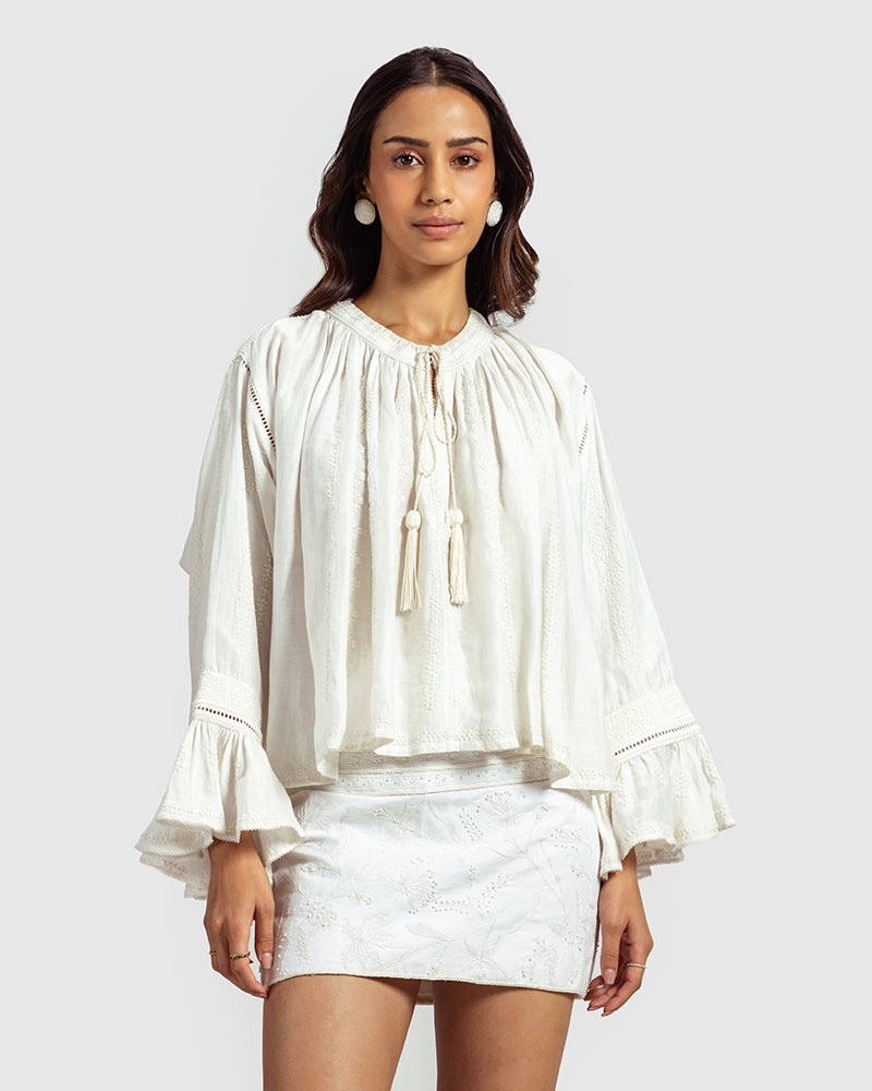 White Embroidered Linen Blend Boho TopProduct DescriptionThis linen blend boho top features an eclectic blend of white-on-white lace and embroidery with Kolam-inspired motifs. Comes in an oversized relaxTopsWhite Embroidered Linen Blend Boho Top