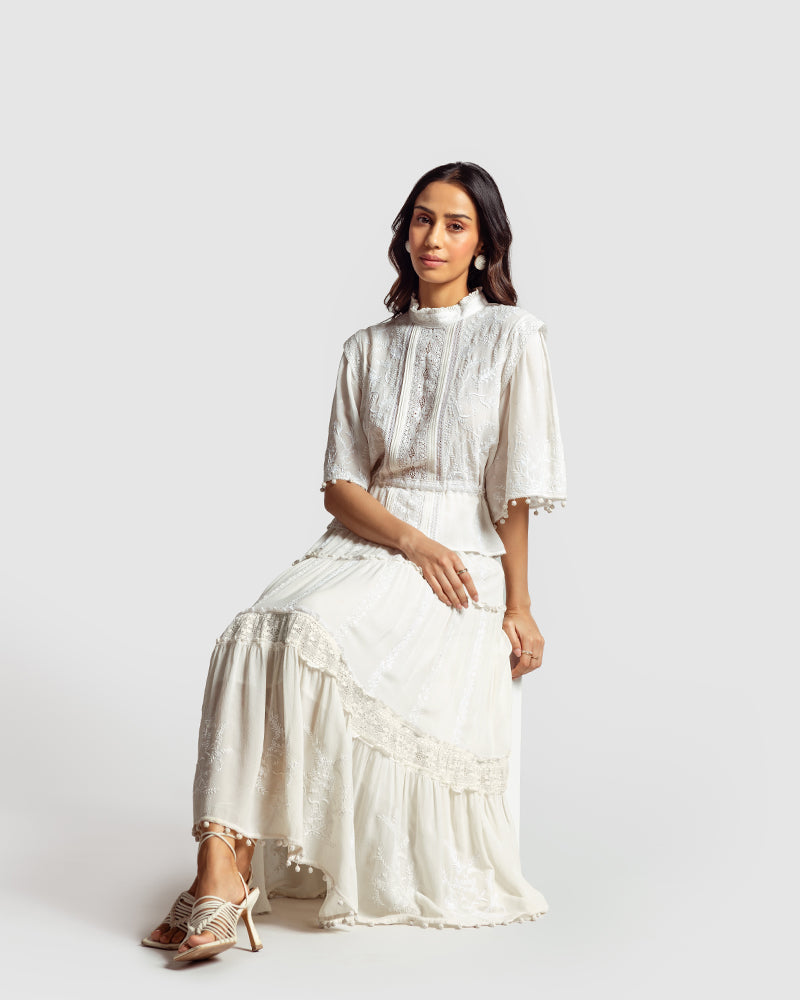 Chikankari Lace Trimmed TopProduct DescriptionMade in collaboration with Sangraha Atelier, this silk georgette top is enveloped in luxe hand chikankari embroidery. The garment also features piTopsChikankari Lace Trimmed Top