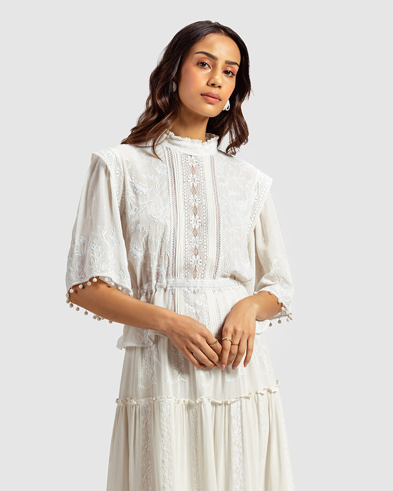 Chikankari Lace Trimmed TopProduct DescriptionMade in collaboration with Sangraha Atelier, this silk georgette top is enveloped in luxe hand chikankari embroidery. The garment also features piTopsChikankari Lace Trimmed Top